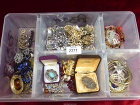 A box containing a large quantity of costume jewellery and parts.