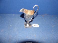 A Silver cream Jug standing on square base, Chester 1831, 98g.