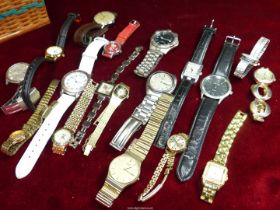 A quantity of ladies and gents wristwatches including Sekonda in wicker sewing box/jewellery box.
