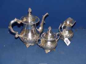 *****A silver PLATED decorative three piece tea set including teapot, milk jug, sugar bowl and lid,
