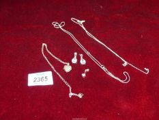 A small quantity of 925 silver items including chains, one with heart locket, pair of earrings, etc.