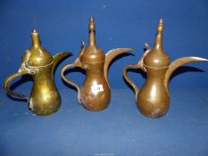 Three vintage brass Islamic coffee pots.