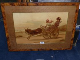 A framed and mounted Lithograph depicting two ladies in a cart being pulled by an exuberant donkey
