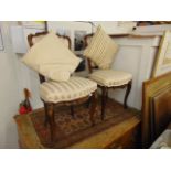 A pair of continental chairs,