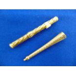 An 18ct Gold, two cigarette holders,