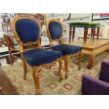 A pair of French chairs on cabriole legs