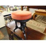 A 19th century revolving Piano stool