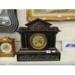 A slate mantle clock, by J.