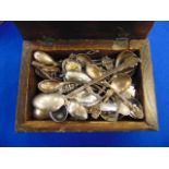 A collection of spoons in a box