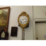 A gilt wall clock, Guibourdenche, a.