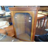 A small glazed corner cabinet