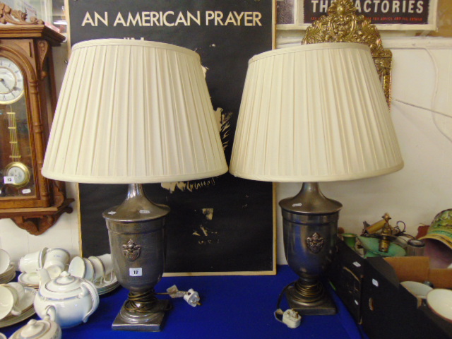 A pair of decorative lamps and shades