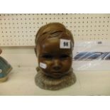 A bust of child's head,