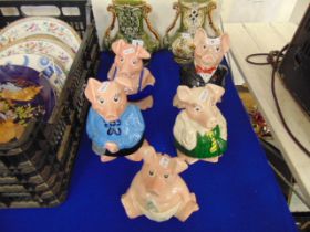 A family of Wade Natwest piggy banks,