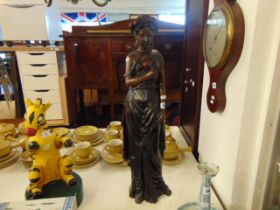 A bronze figure of a lady