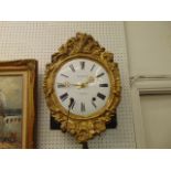 A gilt wall clock, Guibourdenche, a.