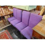 Four purple upholstered dining chairs