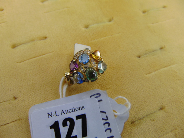 An 18ct GOld multi gem set and Diamond ring,