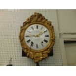 A gilt wall clock, Guibourdenche, a.