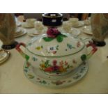 A large lidded tureen with ladle