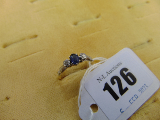An 18ct Gold Sapphire and Diamond three stone ring