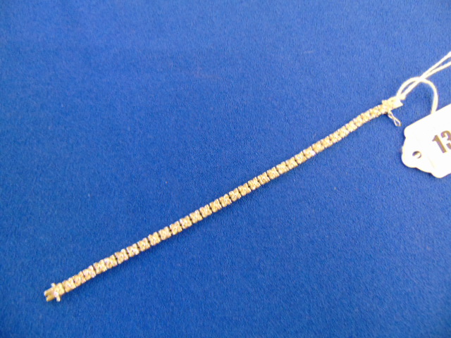 An 18ct White gold Diamond line bracelet, 140 Diamonds in total,