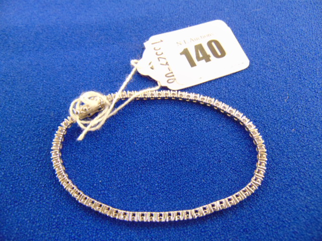 A White metal unmarked Diamond line bracelet,