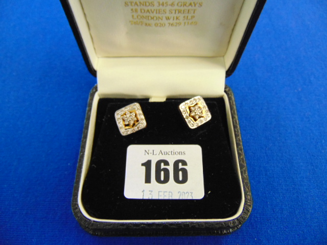 A pair of Gold and Diamond earrings