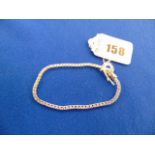 A White metal unmarked Diamond line bracelet,