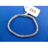 An 18ct White gold Diamond line bracelet, 140 Diamonds in total,