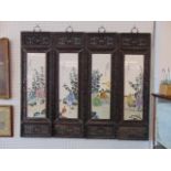 A set of four Chinese porcelain framed hardwood panels