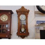 An Oak cased wall clock