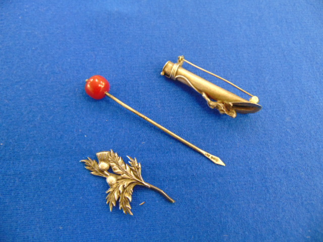 A Silver flower brooch, cocktail stick etc.