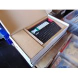 Two boxed Fuze programming computer work stations,