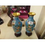 A pair of blue ground Cloissonie vases