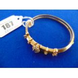 An 18ct Gold Sapphire and Diamond bangle