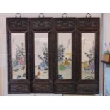 A set of four Chinese porcelain framed hardwood panels