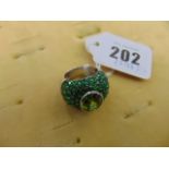 An 18ct White Gold ring, set with Savorite and Peridot centre stone, size N,