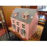 An old dolls house and furniture