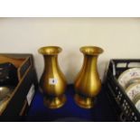 A pair of brass vases,