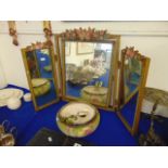 A decorative triple mirror