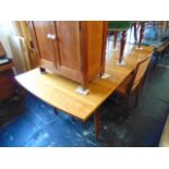 A Mid-century Scandinavian Teak extending dining table and eight chairs ( six chairs and two
