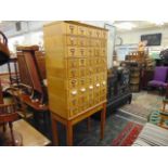 A 1950's Oak index card library, with nine stacks of drawers,