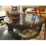 A circular glass and wooden coffee table
