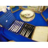A decorative salad bowl plus servers and two boxed sets of flatware