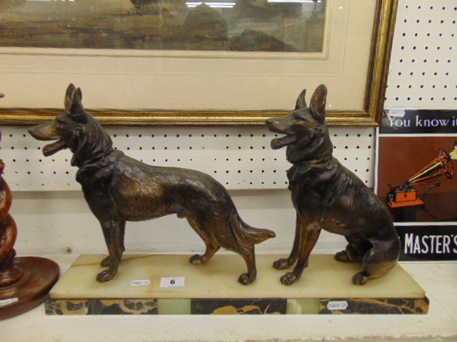 An Artdeco marble based statue of a dog