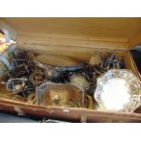 A large suitcase containing silver plate,