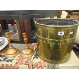 A brass coal bucket and pair of candlesticks