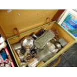 A suitcase containing silver plate,