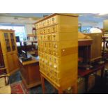 A 1950's Oak index card library, with nine stacks of drawers,